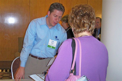 Kris Lyle (L), Computerized Medical Systems, with SATRO attendees