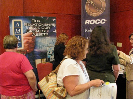 Attendees visiting with exhibitors