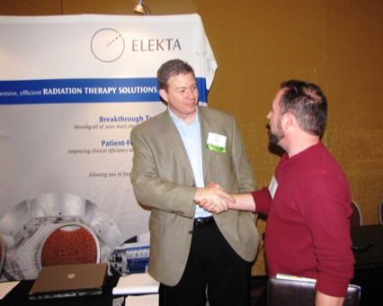 Alex Hill (L) (Elekta) with Attendee