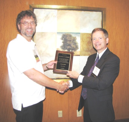 Service Award to Director R. Onken (L) by Director Paul Williams